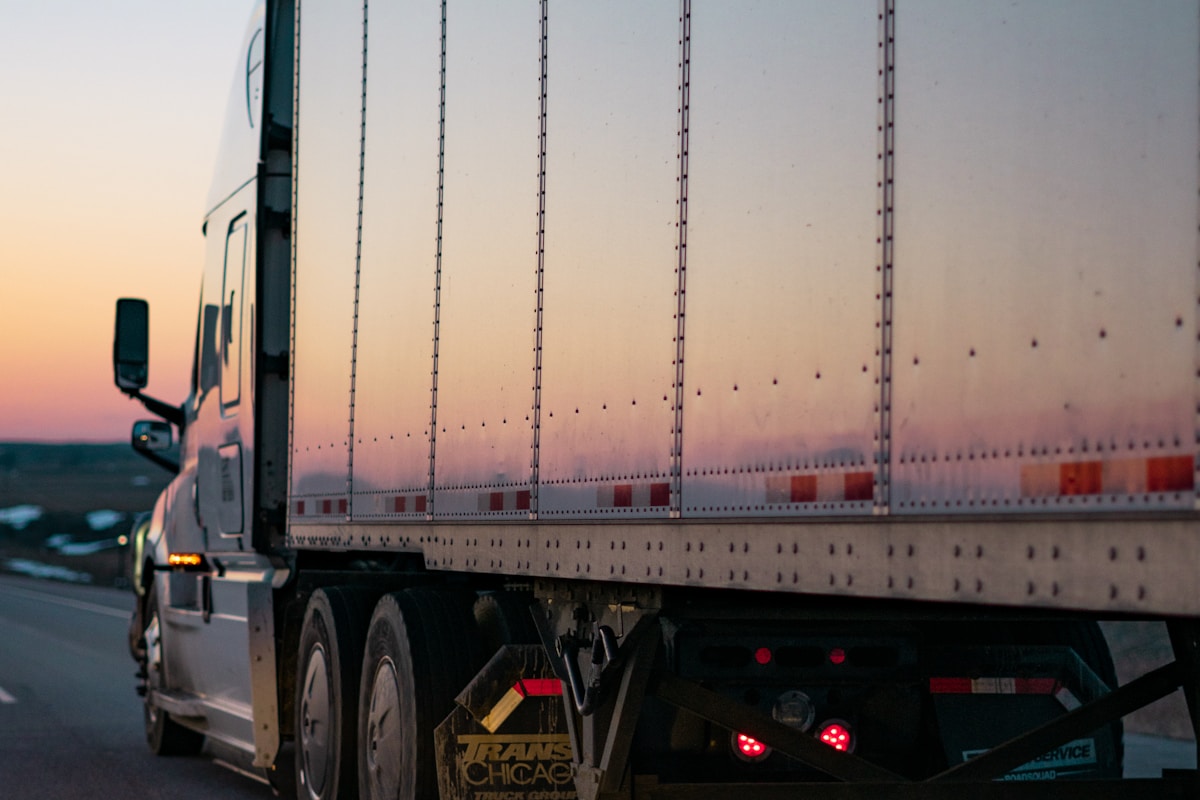 Delivery trucks parked at a logistics distribution center