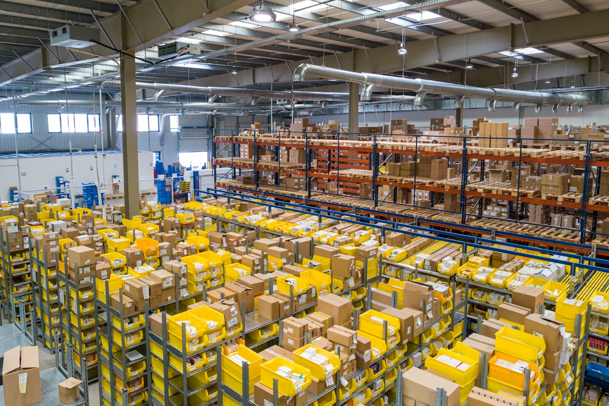 Stacked cardboard boxes inside a warehouse ready for pickup